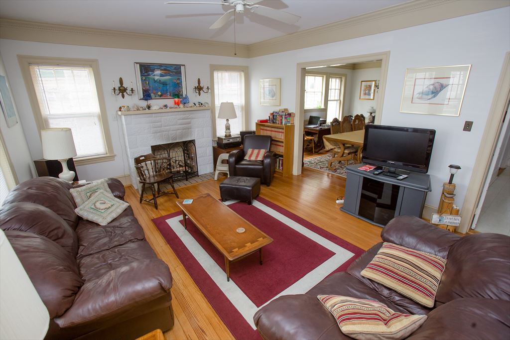 A living room around the fireplace at Azure Estate, Cape May